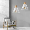 A modern living room scene with a chair and two pendant lights. Produktbild-Vorschau