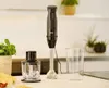 A black hand blender with its accessories on a kitchen counter. Anteprima dell’immagine prodotto