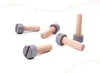 Several wooden bolts with gray heads are scattered on a white surface. Podgląd zdjęcia produktu
