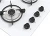 A close-up view of a white gas hob with black control knobs and a burner grate. Náhľad obrázku produktu