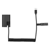 A black dummy battery coupler with a coiled USB-C cable and connector, presented on a white background. Produktbild-Vorschau
