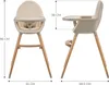 Front and side views of a beige high chair with wooden legs, with dimensions indicated. Produktbild-Vorschau