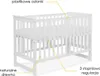 A white baby crib is shown against a white background with yellow lines pointing to different features. Produktbild-Vorschau