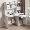 A white computer desk with shelves and drawers, set up in a room with a window and curtains. Podgląd zdjęcia produktu