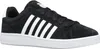 A studio shot of a black K-Swiss sneaker with white stripes and a white sole. Produktbild-Vorschau
