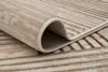 A close-up view of a rolled-up rug, showing its texture and pattern. Anteprima dell’immagine prodotto
