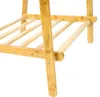 Close-up view of the lower section of a wooden shelf unit, showing the legs and slatted shelves. Podgląd zdjęcia produktu