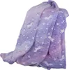 A folded blanket with a unicorn and star pattern. Anteprima dell’immagine prodotto