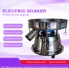 A stainless steel electric shaker machine with text overlays describing its features. Produktbild-Vorschau