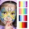 A child with face paint and several colorful palettes. Náhled obrázku produktu