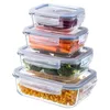 A set of four glass food storage containers stacked on top of each other, each filled with different food items. Podgląd zdjęcia produktu