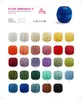 A collage of yarn balls in various colors, with product information and care symbols. Produktbild-Vorschau
