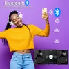 A woman is dancing while wearing headphones and holding a smartphone, with a stereo system and Bluetooth icons in the background. Produktbild-Vorschau