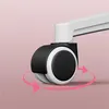 A close-up of a black and white office chair caster wheel with pink arrows indicating rotation. Podgląd zdjęcia produktu