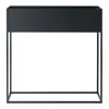 A black rectangular planter box on a black metal stand, presented against a white background. Podgląd zdjęcia produktu