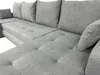 A close-up view of a grey sectional sofa. Náhled obrázku produktu
