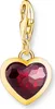 A gold charm with a red heart-shaped gemstone. Náhled obrázku produktu