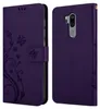 A purple flip phone case with a floral design is shown open, revealing the inside of the case and the back of a phone. Náhled obrázku produktu