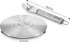 A metal induction adapter plate and a utensil are shown on a white background. Dimensions are indicated with lines and text. Anteprima dell’immagine prodotto