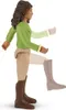 A toy figure of a woman in a green shirt and tan pants, wearing brown boots, shown in a side profile with one leg raised as if walking. Parts of the figure's arms and legs are faded, suggesting movement or articulation. Produktbild-Vorschau