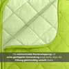 Close-up of a quilted green blanket or comforter, showing the diamond stitching pattern and a folded corner. Produktbild-Vorschau