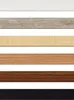 Multiple samples of different materials or finishes arranged horizontally. Voir les images du produit