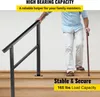 An elderly man is using a handrail to ascend a set of wooden stairs, holding a cane in his other hand. Podgląd zdjęcia produktu