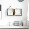 Two wall shelves mounted on a white wall above a desk. Produktbild-Vorschau