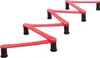 Three red hockey training aids arranged in a staggered pattern against a white background. Podgląd zdjęcia produktu