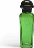 A product shot of a green glass perfume bottle with a black cap. Voir les images du produit