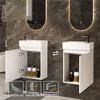 Two identical white bathroom vanity units with sinks are shown side-by-side against a dark marble tiled wall. The left unit has its door open, revealing bottles inside. The right unit has its door closed. Icons with text are displayed at the bottom. Produktbild-Vorschau