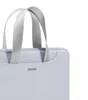 A close-up view of the top portion of a light blue laptop bag with gray handles. Náhľad obrázku produktu