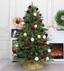 A decorated Christmas tree with red, green, and white ornaments. Voir les images du produit