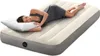 A woman sleeping on an inflatable mattress. Produktbild-Vorschau