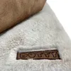 A close-up of a dog mat with a brown leather tag that says "DOTTY". Produktbild-Vorschau