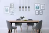 A dining room with a table, chairs, and a pendant light fixture. Produktbild-Vorschau