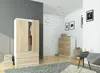 A bedroom or hallway scene featuring a wardrobe and chest of drawers. Produktbild-Vorschau