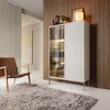 A modern living room scene featuring a display cabinet, a chair, and a rug. Produktbild-Vorschau