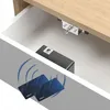 An electronic lock mechanism installed inside a wooden drawer, with RFID cards shown nearby. Produktbild-Vorschau
