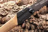 A close-up of a folding saw resting on a textured, bark-like surface. Produktbild-Vorschau