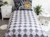 A bedroom setting with a bed featuring Harry Potter themed bedding. Náhled obrázku produktu
