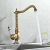 A vintage-style kitchen faucet with water running into a sink. Náhľad obrázku produktu
