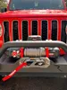 The front of a red Jeep with a winch mounted on the bumper. Anteprima dell’immagine prodotto