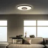 A modern living room with a dining table and sofa, featuring a ceiling lamp. Produktbild-Vorschau