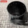 A black trash can with its lid next to it, placed on a paved surface. Podgląd zdjęcia produktu