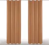 Two brown curtains hanging from a rod. Produktbild-Vorschau