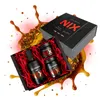A gift set of mustard products, including a bottle and two jars, arranged in a black box with red crinkle paper. The set is surrounded by splashes of sauce and spices. Produktbild-Vorschau