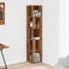 A tall, narrow corner shelf unit made of wood-look material, placed in a room corner. It displays several decorative items and books on its shelves. Náhled obrázku produktu