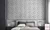 A bedroom with a bed and a wall covered in 3D panels. Produktbild-Vorschau
