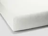 A close-up, angled view of a white fitted sheet. Produktbild-Vorschau